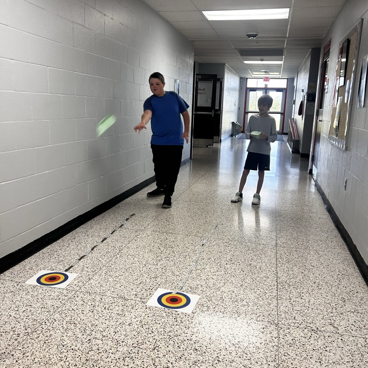 6th grade PLTW making paper airplane gliders to learn about the design process and using an engineer’s notebook to document their designs. 