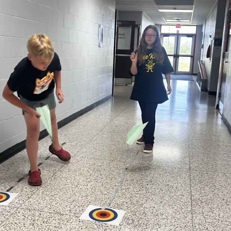 6th grade PLTW making paper airplane gliders to learn about the design process and using an engineer’s notebook to document their designs. 