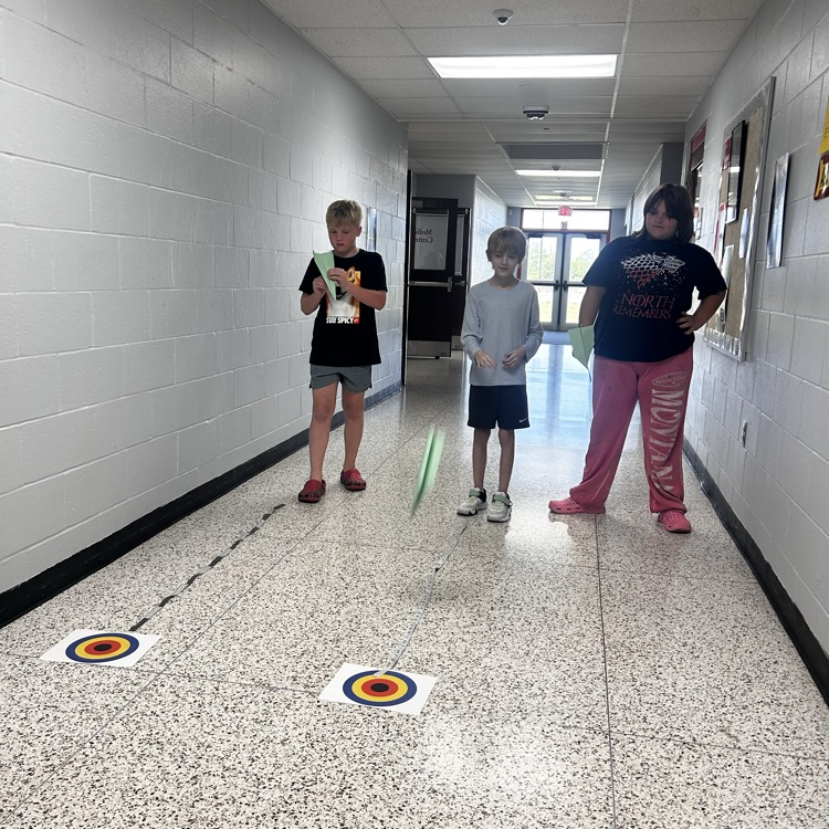 6th grade PLTW making paper airplane gliders to learn about the design process and using an engineer’s notebook to document their designs. 