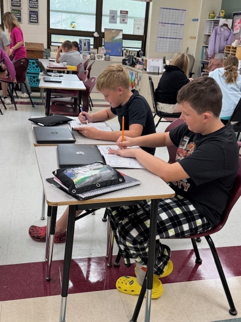 Students in Mrs. Starline’s language arts class used the “Stand Up, Hand Up, Pair Up" strategy to find partners and complete a vocabulary activity. 