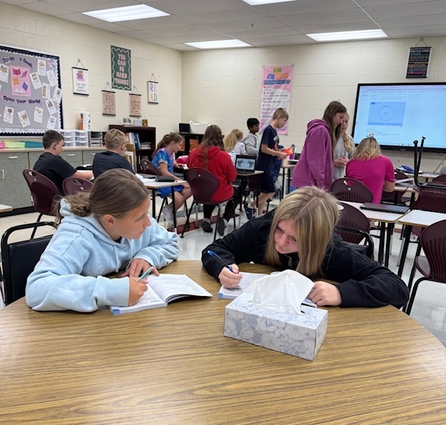 Students in Mrs. Starline’s language arts class used the “Stand Up, Hand Up, Pair Up" strategy to find partners and complete a vocabulary activity. 