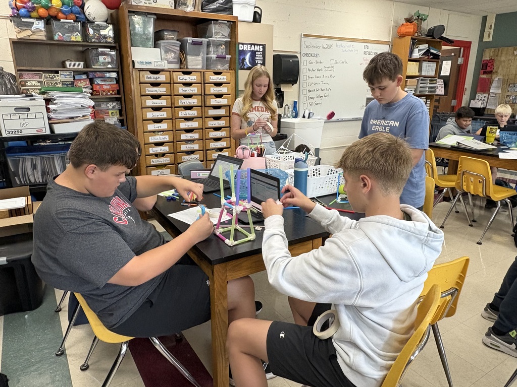STEM students put the engineer and design process to work and build straw towers. #8389:  STEM students ignite their curiosity as they analyze clues in Mystery Bags to discover expectations in class this year.
