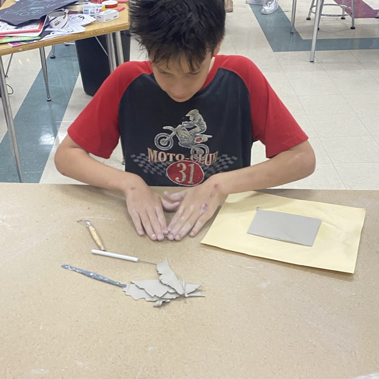 7th grade Art students working on their Clay Junk Food project.