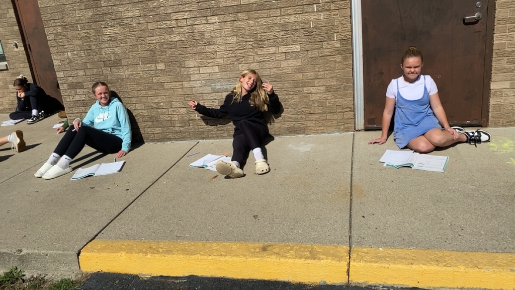 Students solved math problems with rational numbers while enjoying the sun. 