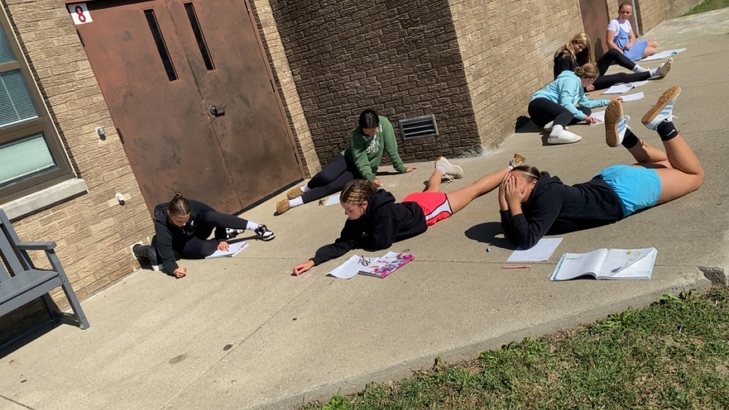 Students solved math problems with rational numbers while enjoying the sun. 