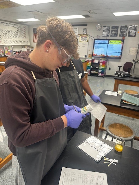 Science students busy with hands on lessons in investigative science