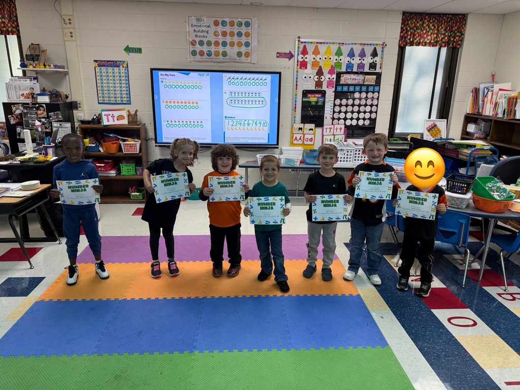 Students displaying their recognition certificates