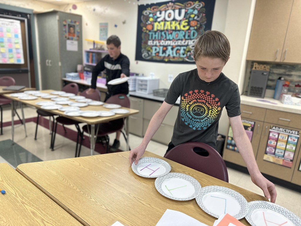 Students review for a test by having plate races!