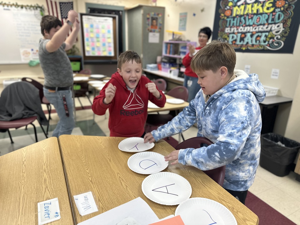 Students review for a test by having plate races!