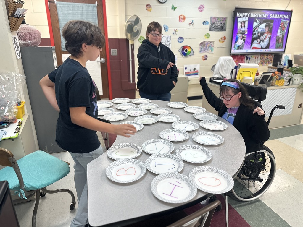 Students review for a test by having plate races!