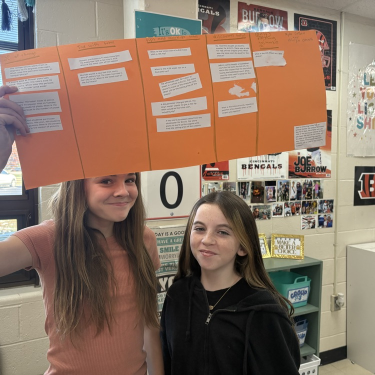 7th grade math students engaged in a collaborative activity to classify percent problems by type, including percent change, tax, and discounts. This helped them deepen their understanding of how percentages are applied in real-world situations.