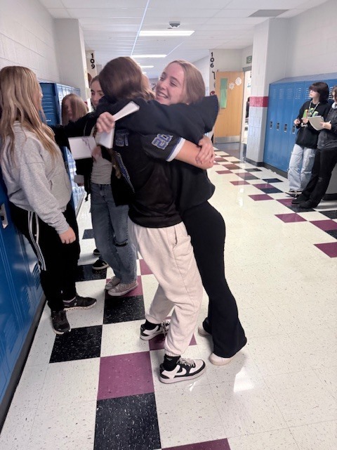 two students hugging