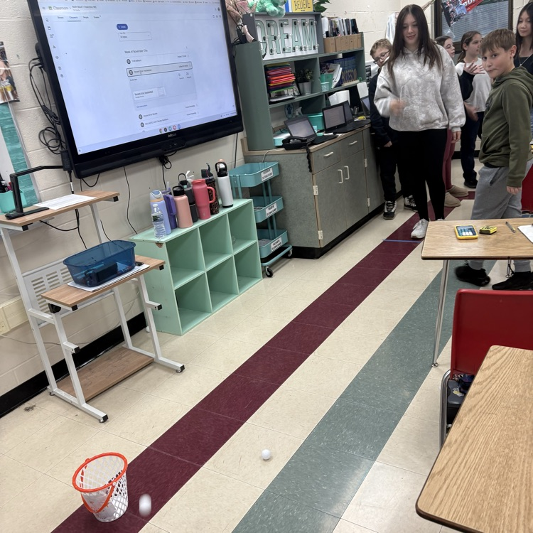 7th graders predicted how many baskets they thought they’d make out of 10, then took 10 real shots to test their accuracy. Using proportions, they calculated their percent error to compare their predictions to their actual results. 