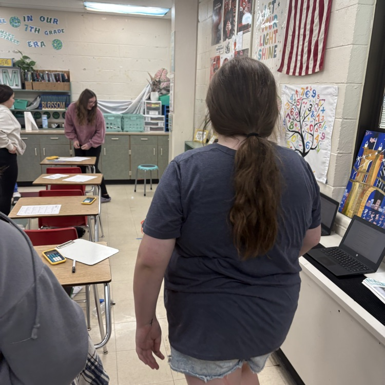 7th graders predicted how many baskets they thought they’d make out of 10, then took 10 real shots to test their accuracy. Using proportions, they calculated their percent error to compare their predictions to their actual results. 
