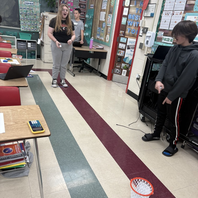 7th graders predicted how many baskets they thought they’d make out of 10, then took 10 real shots to test their accuracy. Using proportions, they calculated their percent error to compare their predictions to their actual results. 