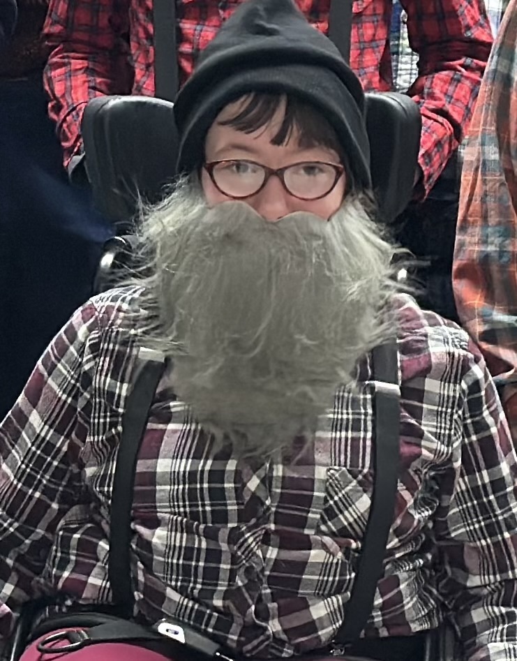 Students dressed as lumberjacks getting ready to cut down Christmas trees for the day after Thanksgiving.