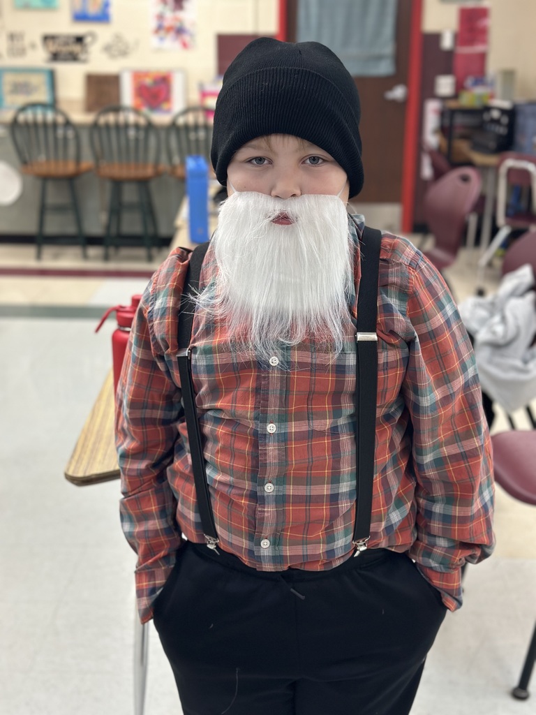 Students dressed as lumberjacks getting ready to cut down Christmas trees for the day after Thanksgiving.