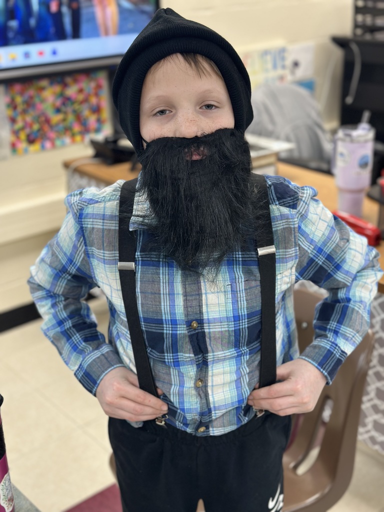 Students dressed as lumberjacks getting ready to cut down Christmas trees for the day after Thanksgiving.