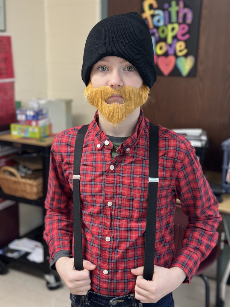 Students dressed as lumberjacks getting ready to cut down Christmas trees for the day after Thanksgiving.