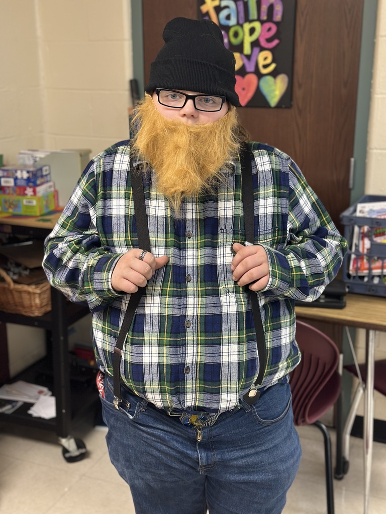 Students dressed as lumberjacks getting ready to cut down Christmas trees for the day after Thanksgiving.