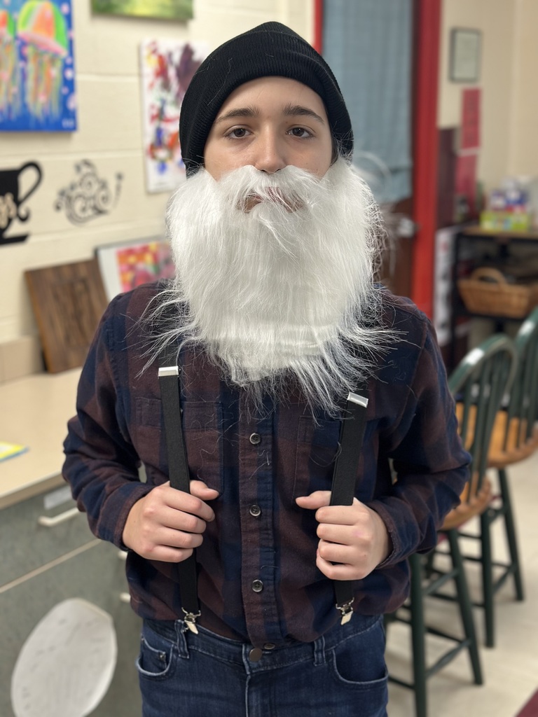 Students dressed as lumberjacks getting ready to cut down Christmas trees for the day after Thanksgiving.