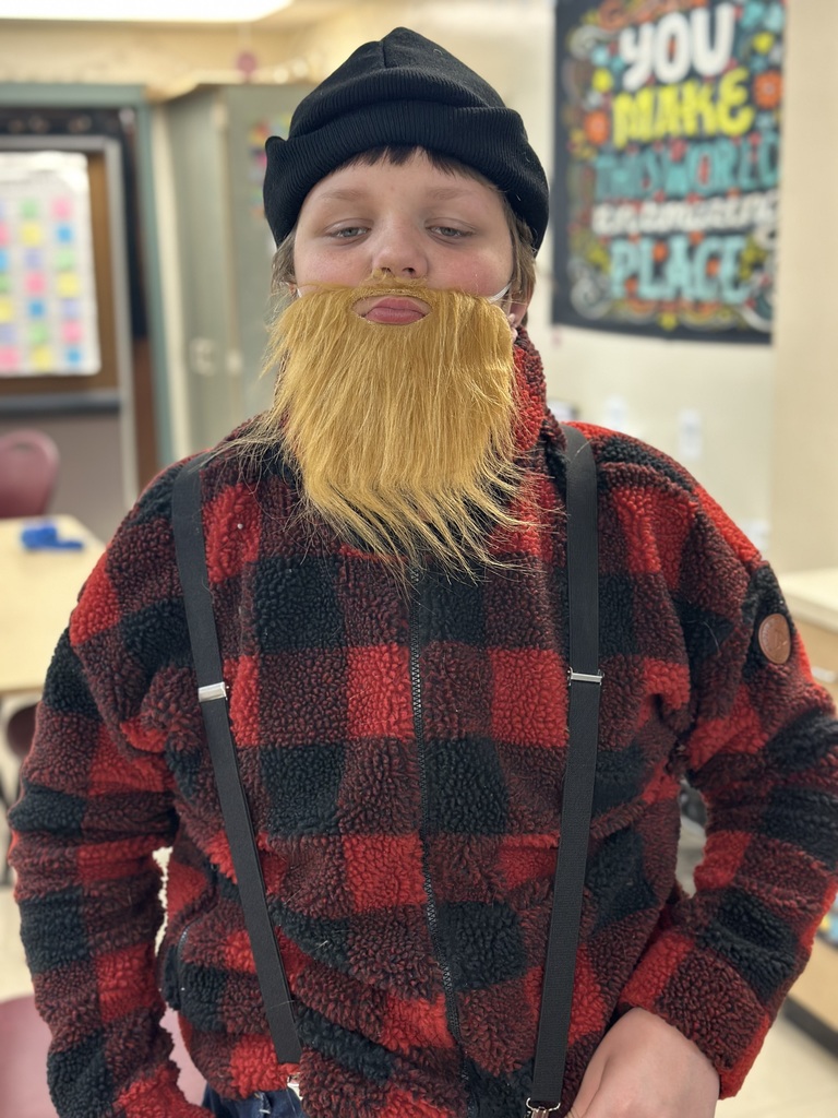 Students dressed as lumberjacks getting ready to cut down Christmas trees for the day after Thanksgiving.
