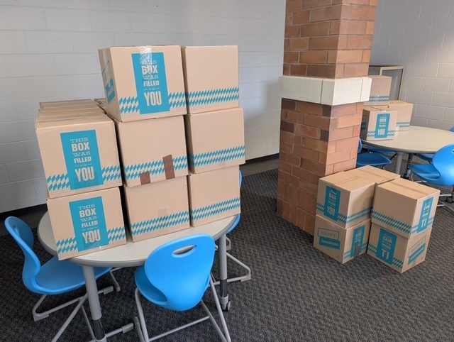 Boxes containing fixings for a Thanksgiving meal. All donated by Crossroads Church East Side