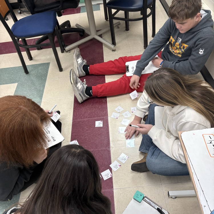 7th grade math students worked in trios using an “I Have, Who Has” activity to actively practice simplifying expressions with the distributive property and combining like terms