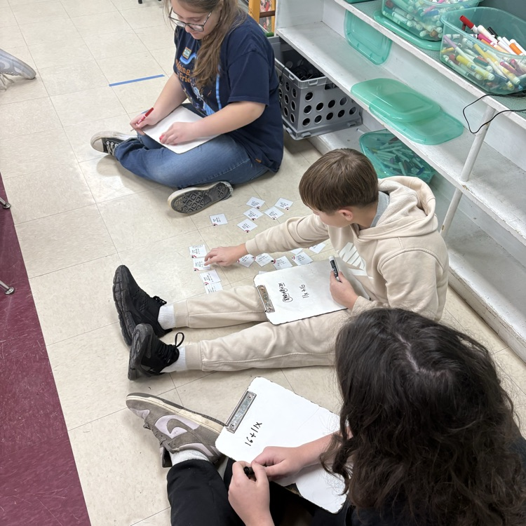7th grade math students worked in trios using an “I Have, Who Has” activity to actively practice simplifying expressions with the distributive property and combining like terms