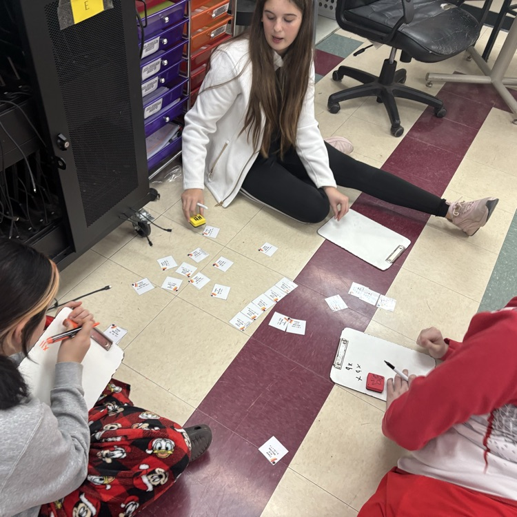 7th grade math students worked in trios using an “I Have, Who Has” activity to actively practice simplifying expressions with the distributive property and combining like terms