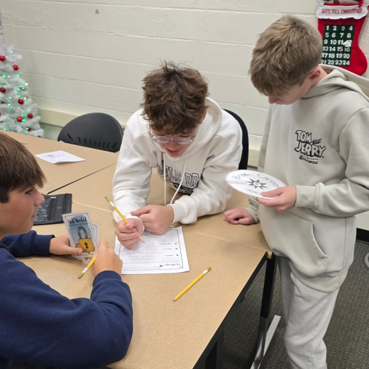 8th graders are saving the world from an alien invasion by completing escape room activities that test their Career and College knowledge. 