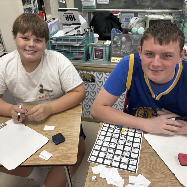 7th graders practiced simplifying linear equations using the game Chutes & Ladders. 