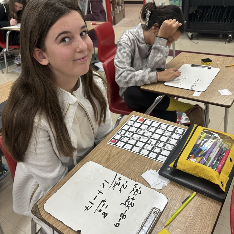 7th graders practiced simplifying linear equations using the game Chutes & Ladders. 