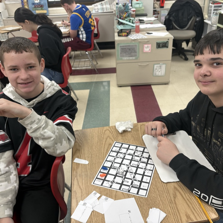 7th graders practiced simplifying linear equations using the game Chutes & Ladders. 