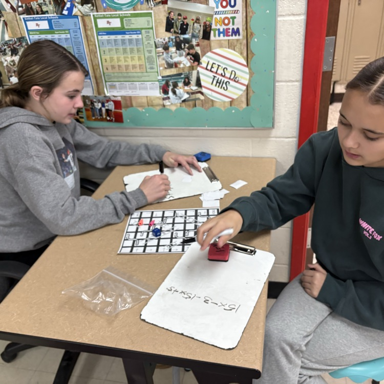 7th graders practiced simplifying linear equations using the game Chutes & Ladders. 