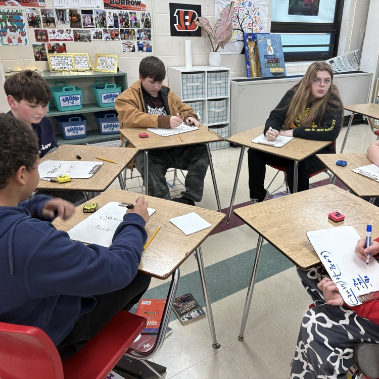 7th graders practiced simplifying linear equations using the game Chutes & Ladders. 