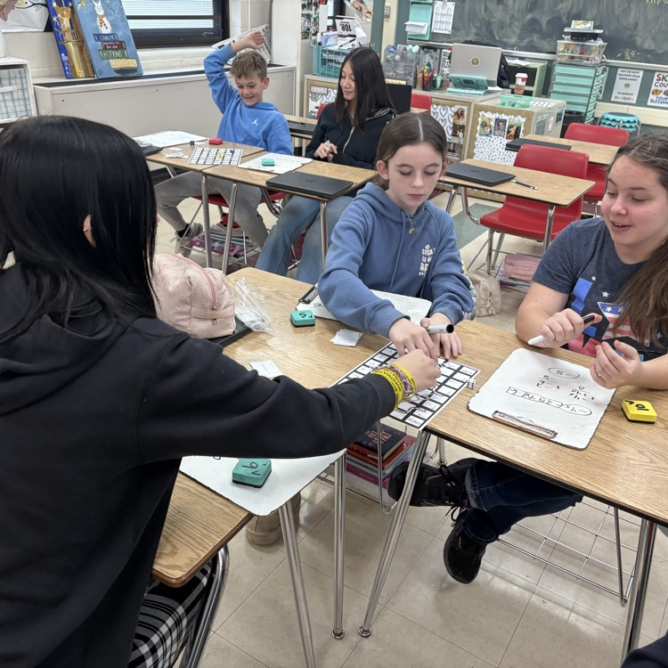 7th graders practiced simplifying linear equations using the game Chutes & Ladders. 