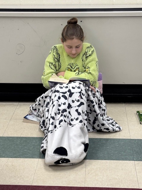 Sixth grade students participated in a Read-A-Thon before winter break, spending the day cozily reading books in the classroom.  