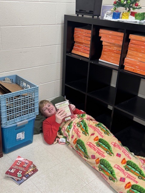 Sixth grade students participated in a Read-A-Thon before winter break, spending the day cozily reading books in the classroom.  