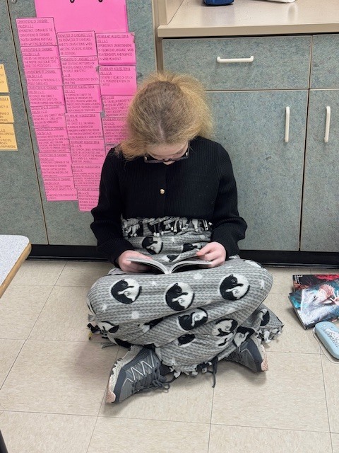 Sixth grade students participated in a Read-A-Thon before winter break, spending the day cozily reading books in the classroom.  