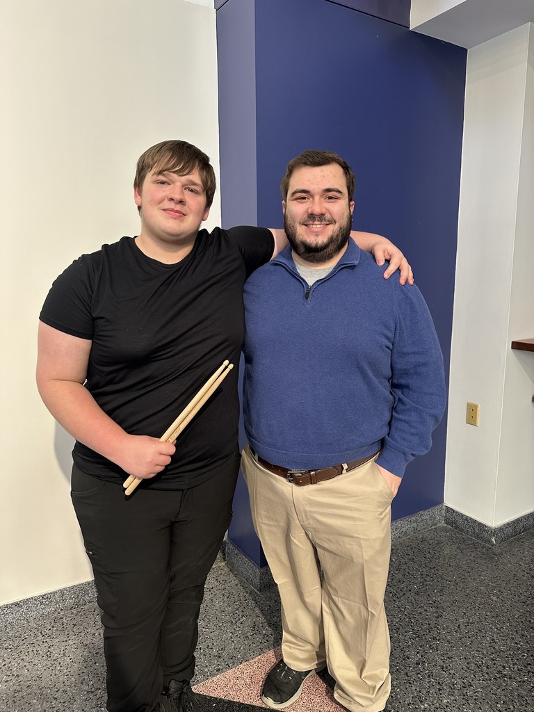 Band student with director