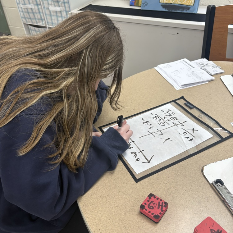 7th grade students collaborated in groups to solve and graph inequalities, choosing from multiple levels of questions to challenge their understanding.