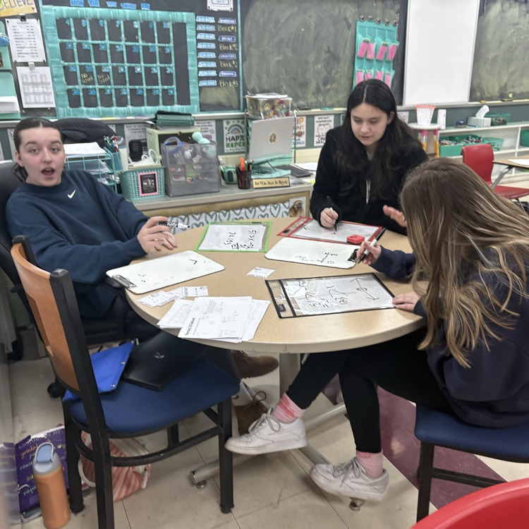 7th grade students collaborated in groups to solve and graph inequalities, choosing from multiple levels of questions to challenge their understanding.