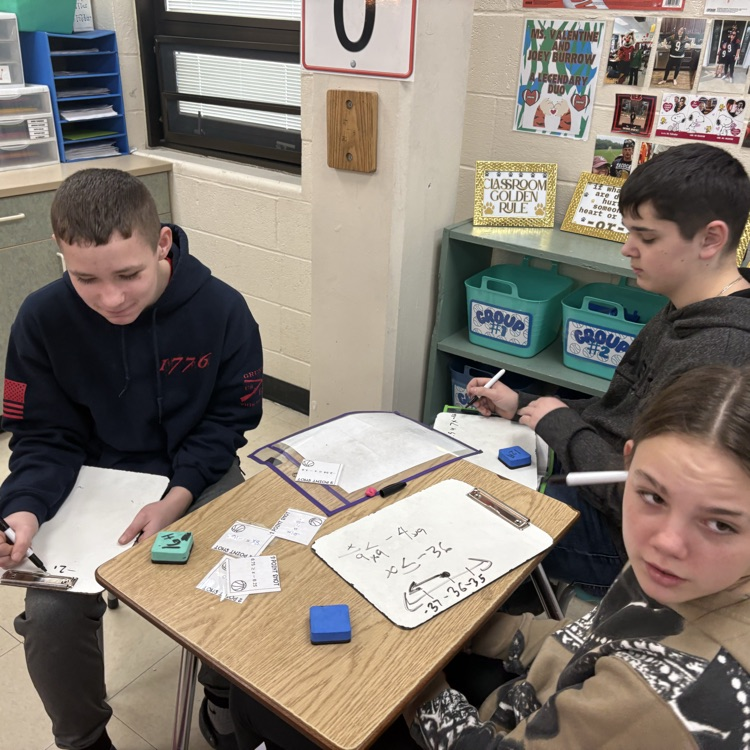 7th grade students collaborated in groups to solve and graph inequalities, choosing from multiple levels of questions to challenge their understanding.