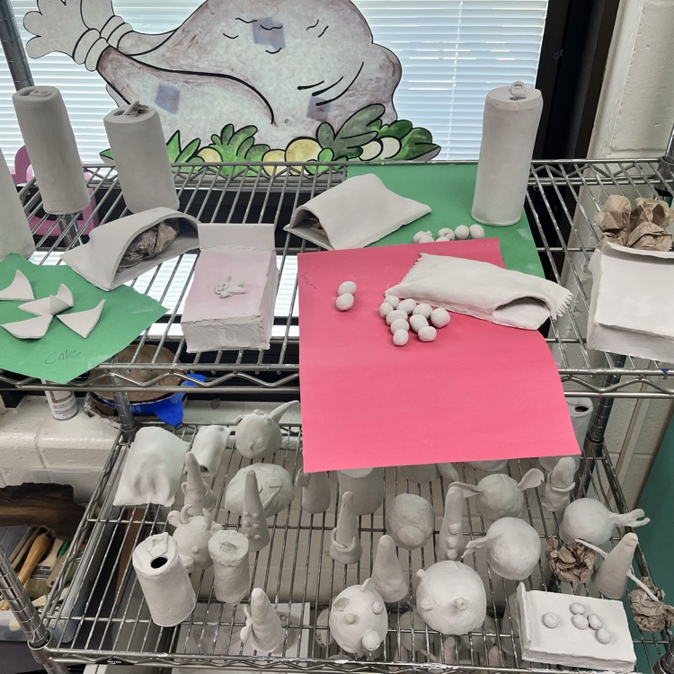 For FB:  7th graders finished sculpting their clay junk food this week, so next week they will be painting them.  And as you see, some of our students take their art project VERY seriously!  Violet really wanted her’s to look realistic 😃 