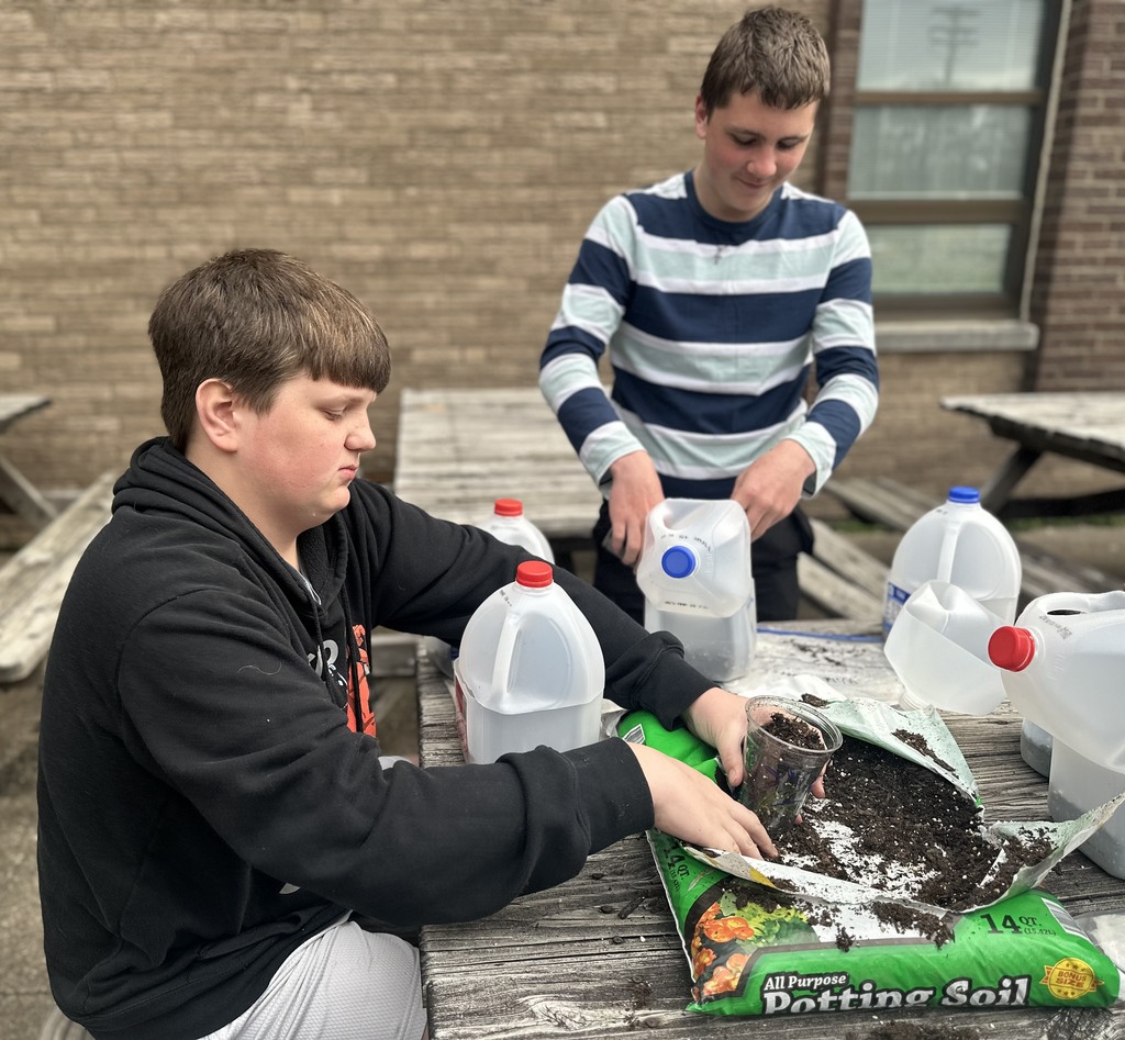 After studying the life cycles of the monarch butterfly and of plants, students used recycled milk jugs to plant seeds to grow their own butterfly gardens. They planted both milkweed and wildflowers.