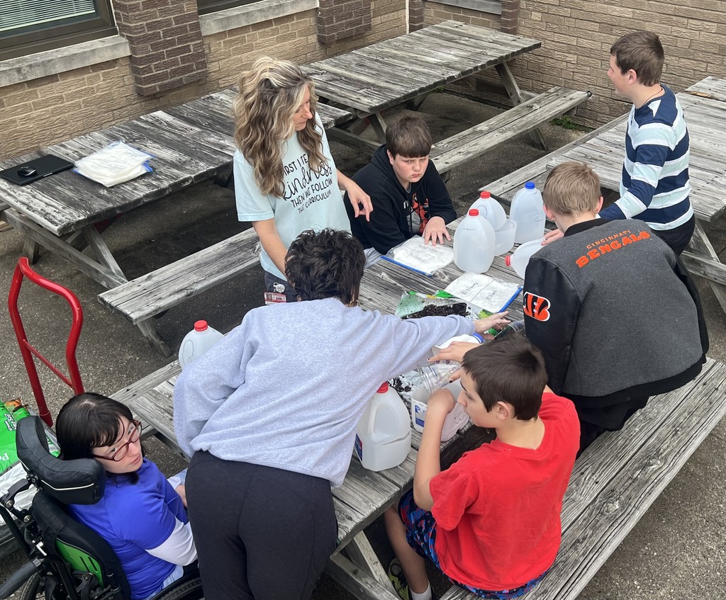 After studying the life cycles of the monarch butterfly and of plants, students used recycled milk jugs to plant seeds to grow their own butterfly gardens. They planted both milkweed and wildflowers.
