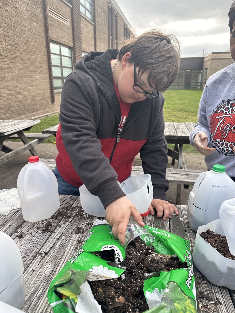 After studying the life cycles of the monarch butterfly and of plants, students used recycled milk jugs to plant seeds to grow their own butterfly gardens. They planted both milkweed and wildflowers.