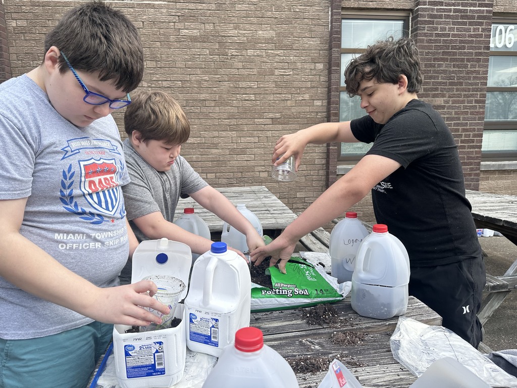 After studying the life cycles of the monarch butterfly and of plants, students used recycled milk jugs to plant seeds to grow their own butterfly gardens. They planted both milkweed and wildflowers.