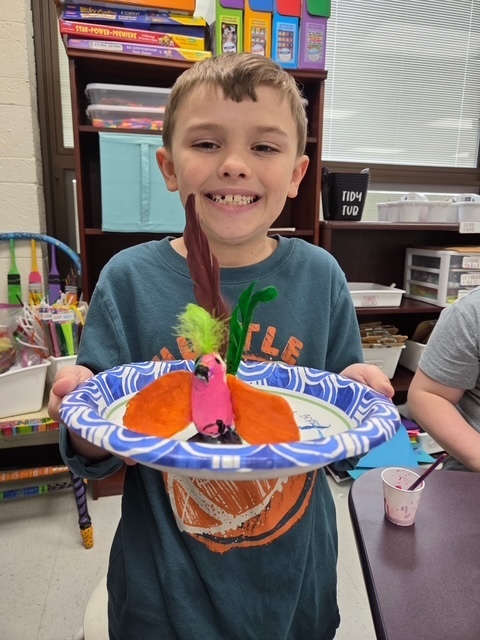Child holding animal creation